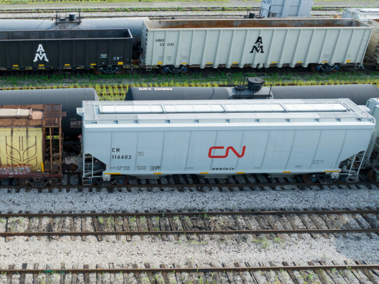 A new CN Rail hopper train car is seen at a railyard.