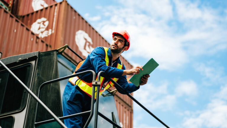 Warehouse engineer worker working at industrial container yard